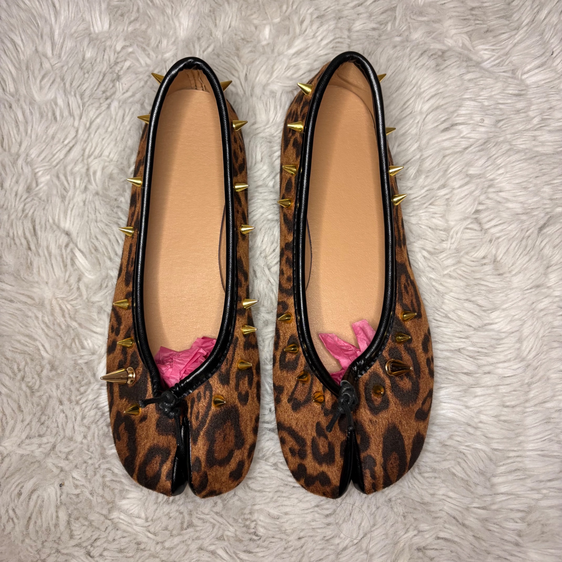 Brown Cheetah spiked Tabi flats with gold spikes viewed from above